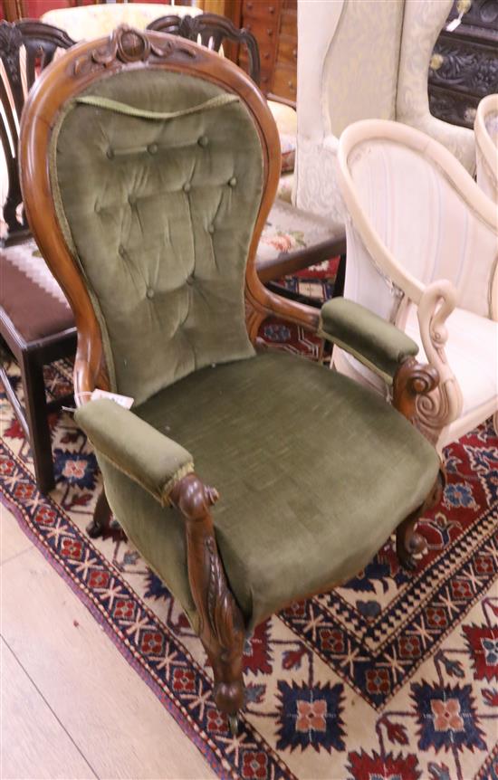 A Victorian walnut spoonback armchair